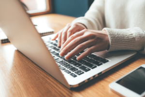 Woman typing on computer