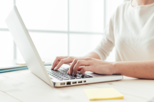 Woman typing on computer